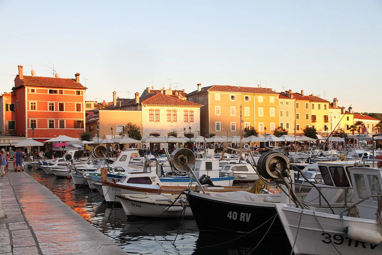 Boats in Rovinj harbour at golden hour.