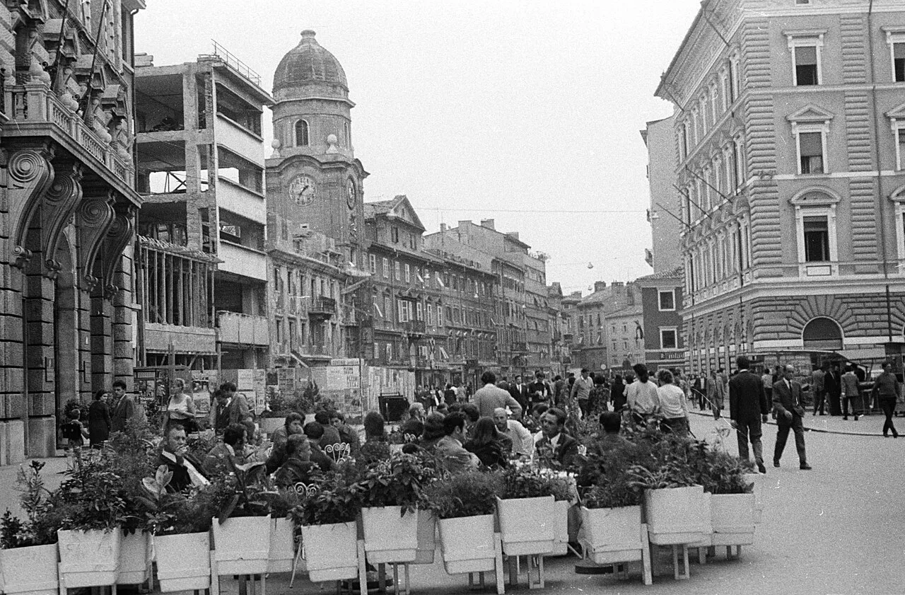 A café terrace on the Korzo below the City Tower, Rijeka, in a historic photo.