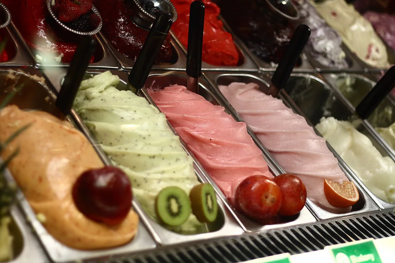 Fruit sorbetto flavours in a gelato counter.