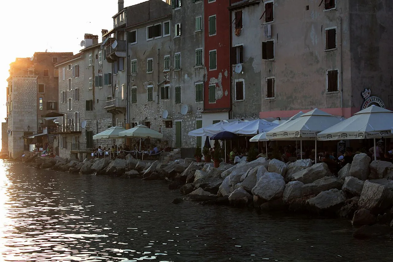 Waterfront restaurant umbrellas below the old town, Rovinj.