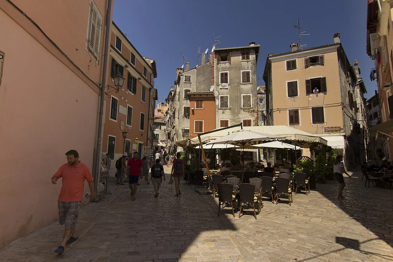 Restaurant tables on an old-town square, Rovinj.