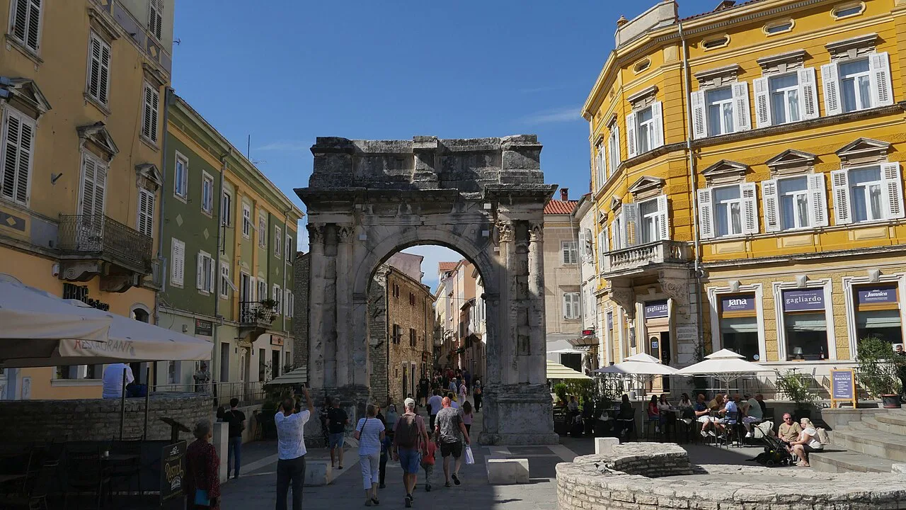 The Arch of the Sergii and the café terraces around it, Pula.