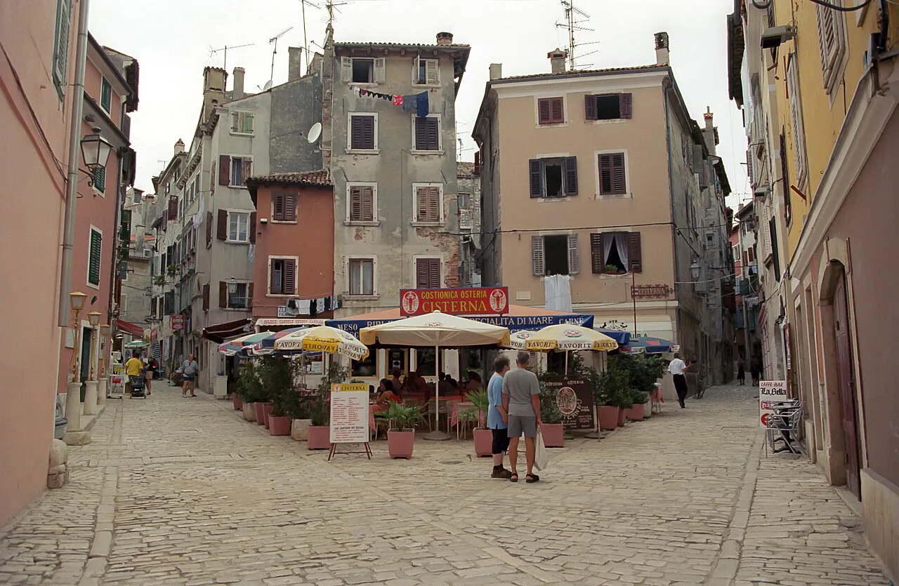 Restaurant umbrellas on a street in Rovinj's old town.