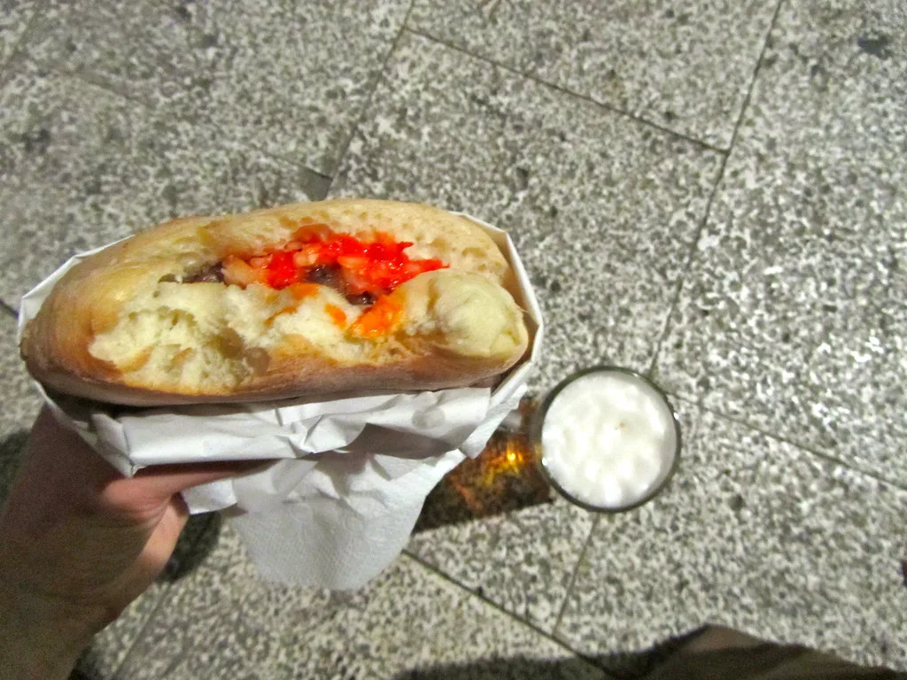 Ćevapi in lepinja flatbread with ajvar.