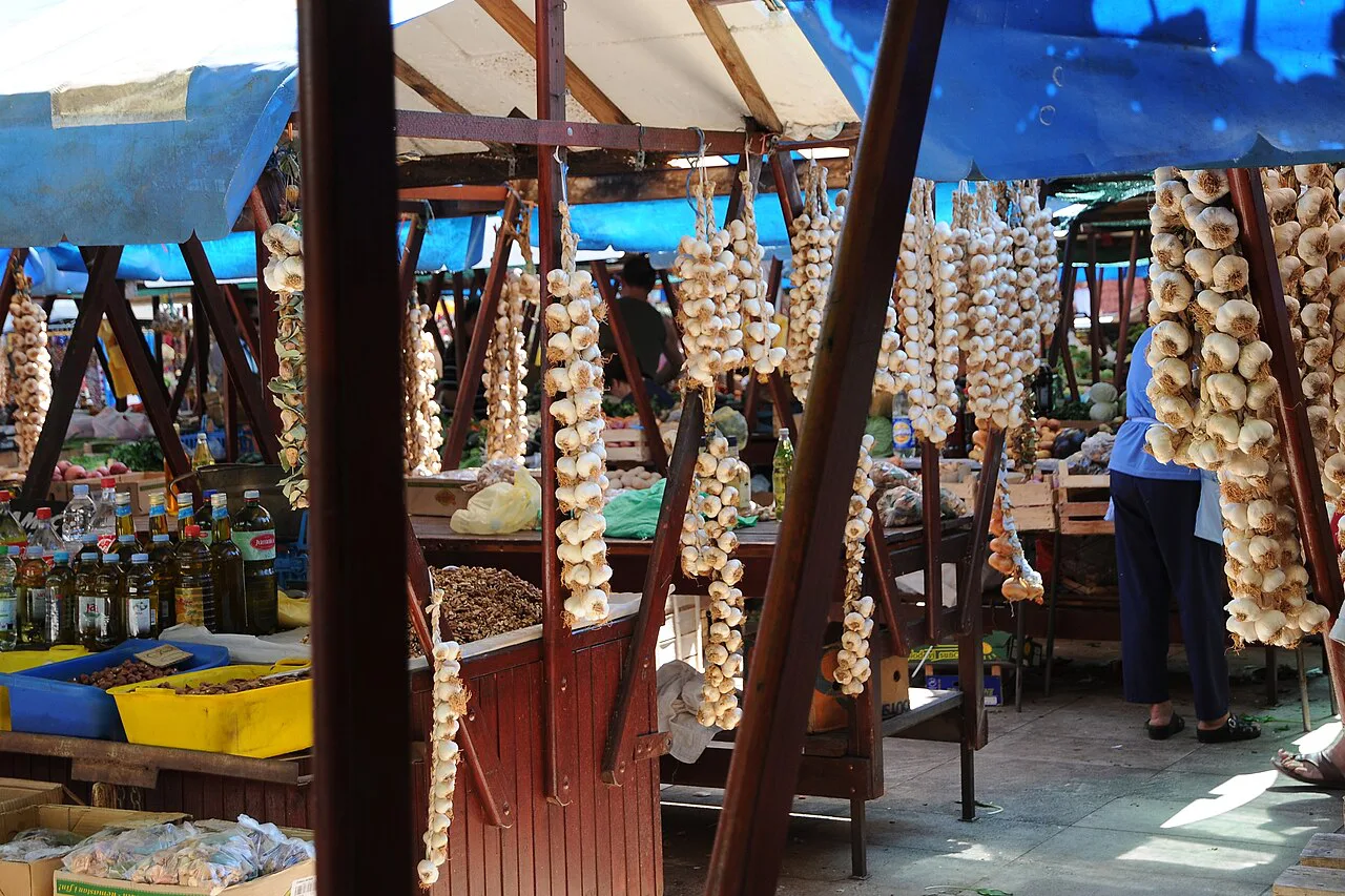 Garlic and produce stalls at the old-town market, Zadar.