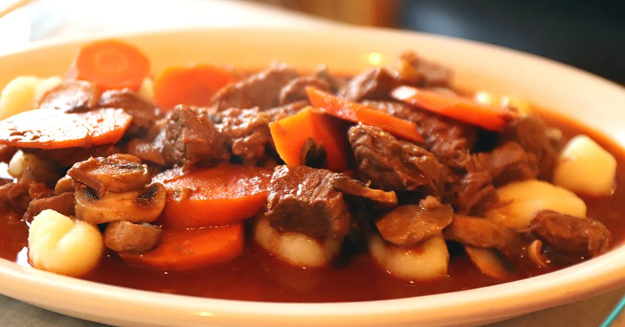 Beef goulash with mushrooms and carrots.