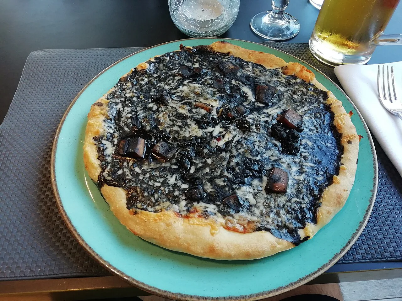 Pizza topped with squid ink.