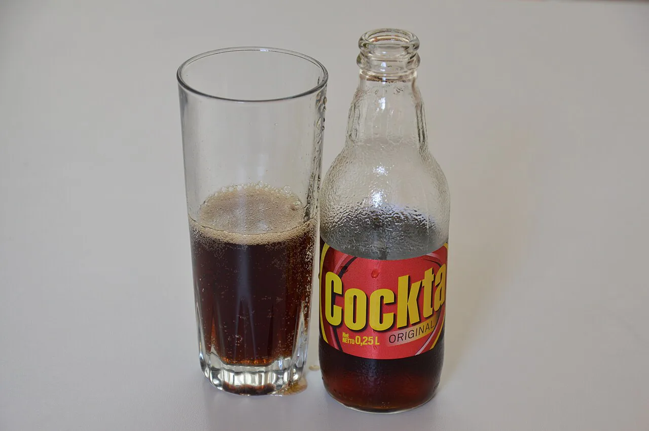A bottle and glass of Cockta.