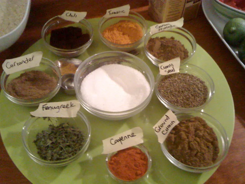 Ground spices set out in small glass bowls.