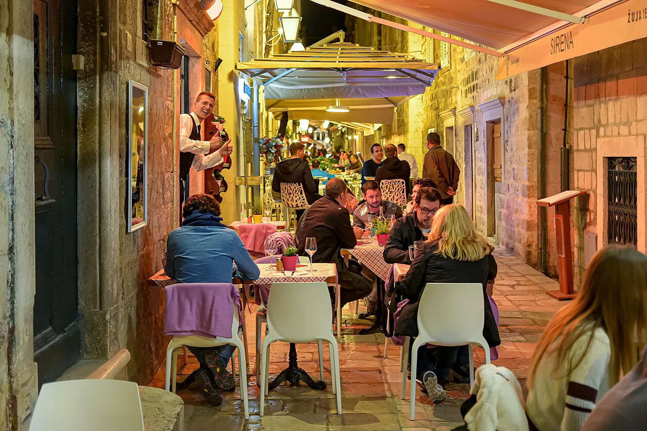 Restaurant tables in a narrow lane of the Old Town, Dubrovnik.