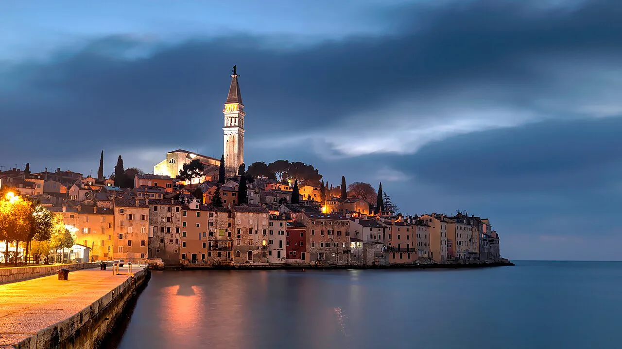 Rovinj's old town and bell tower by night.