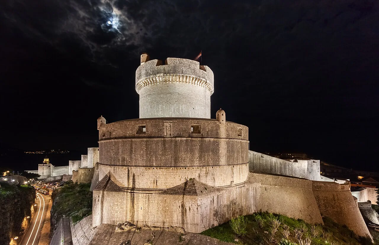 The Minčeta Tower on Dubrovnik's city walls at night.