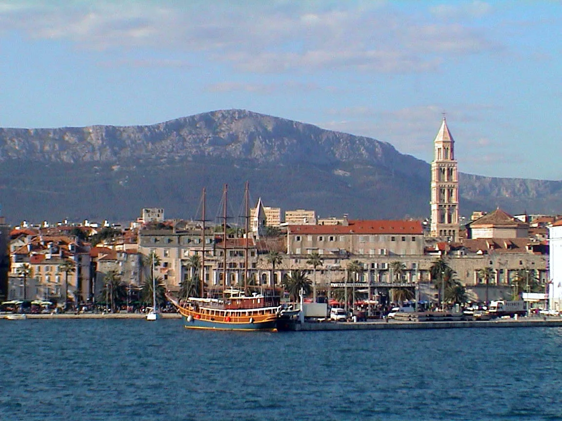 Split's waterfront and old town seen across the harbour.