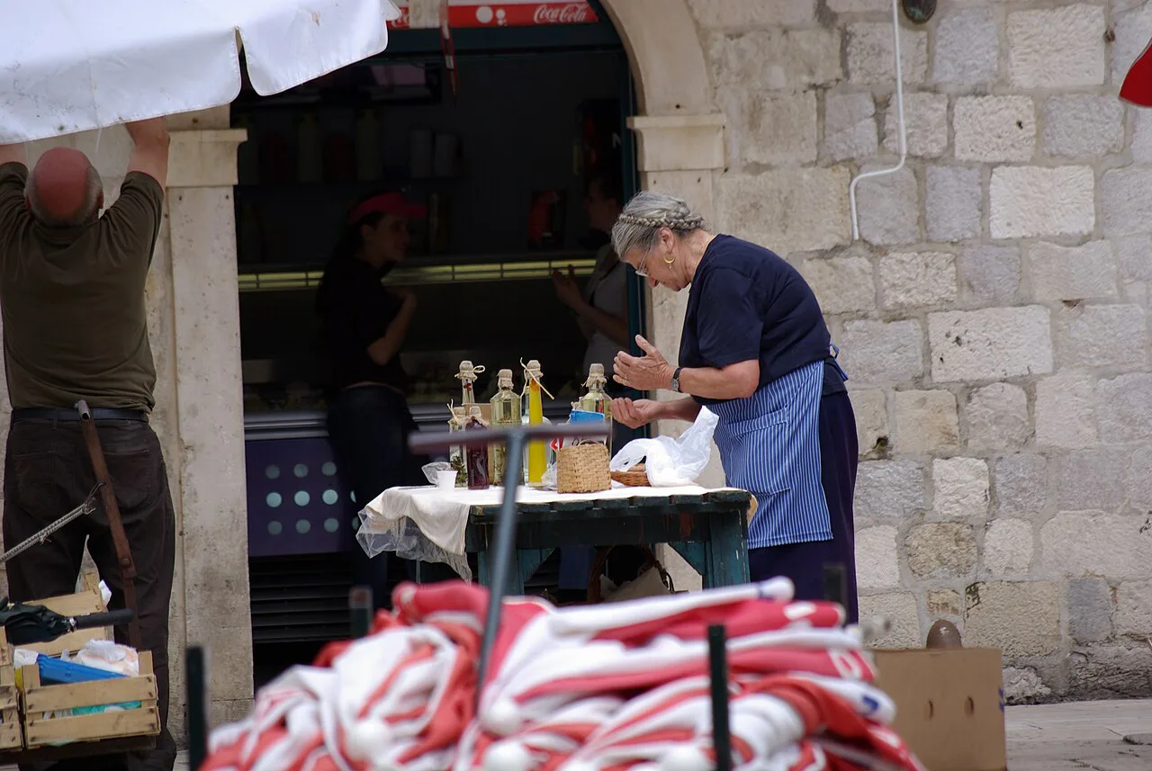 A vendor at the Gundulićeva poljana market, Dubrovnik.