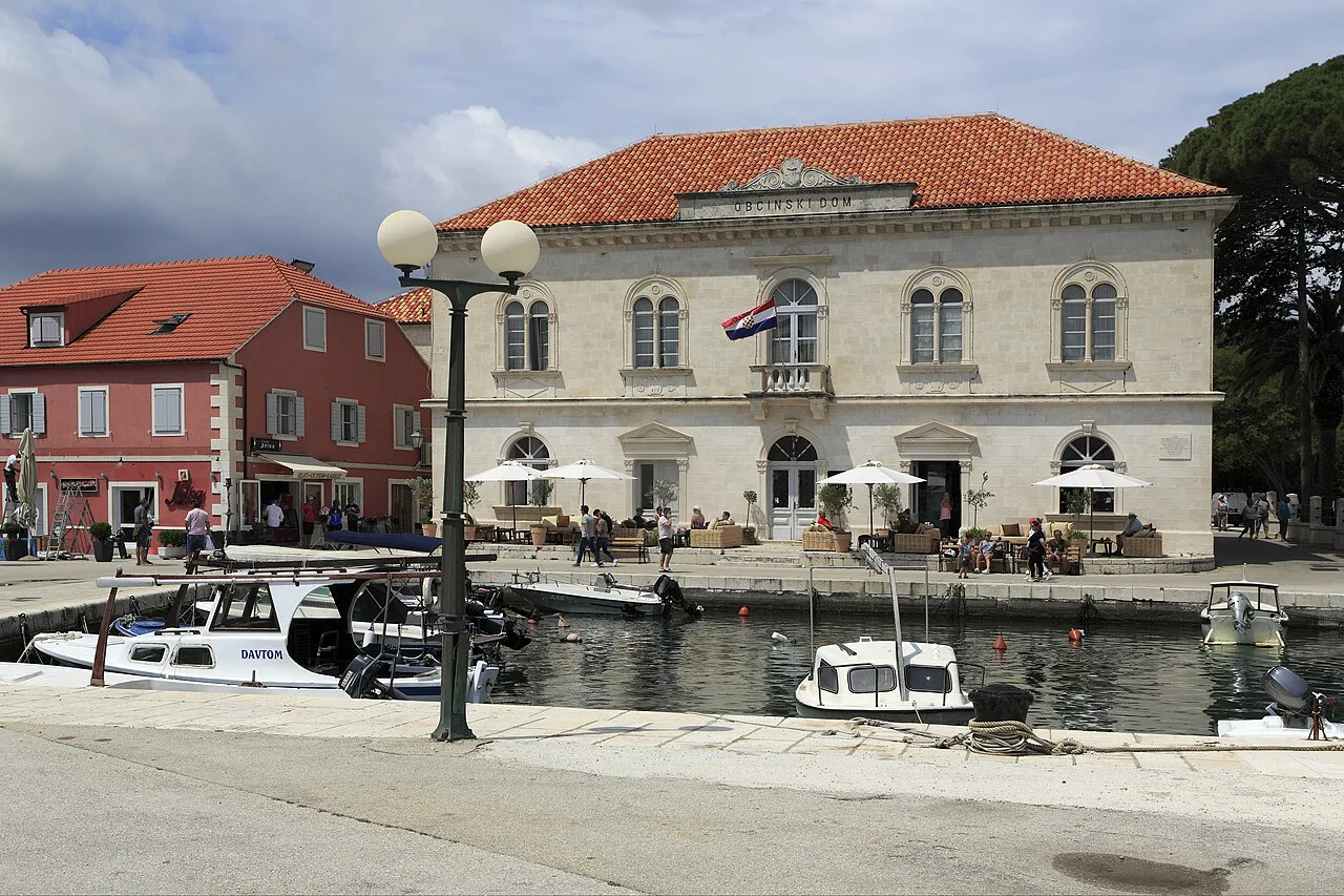 The town hall and café tables at the head of Jelsa harbour, Hvar.