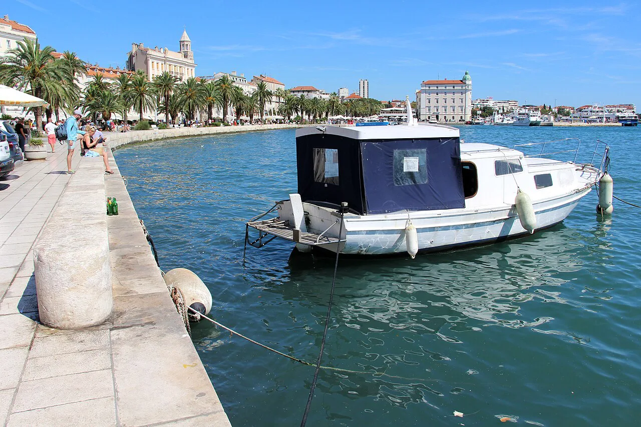 A small boat at Matejuška harbour, with the Riva behind, Split.
