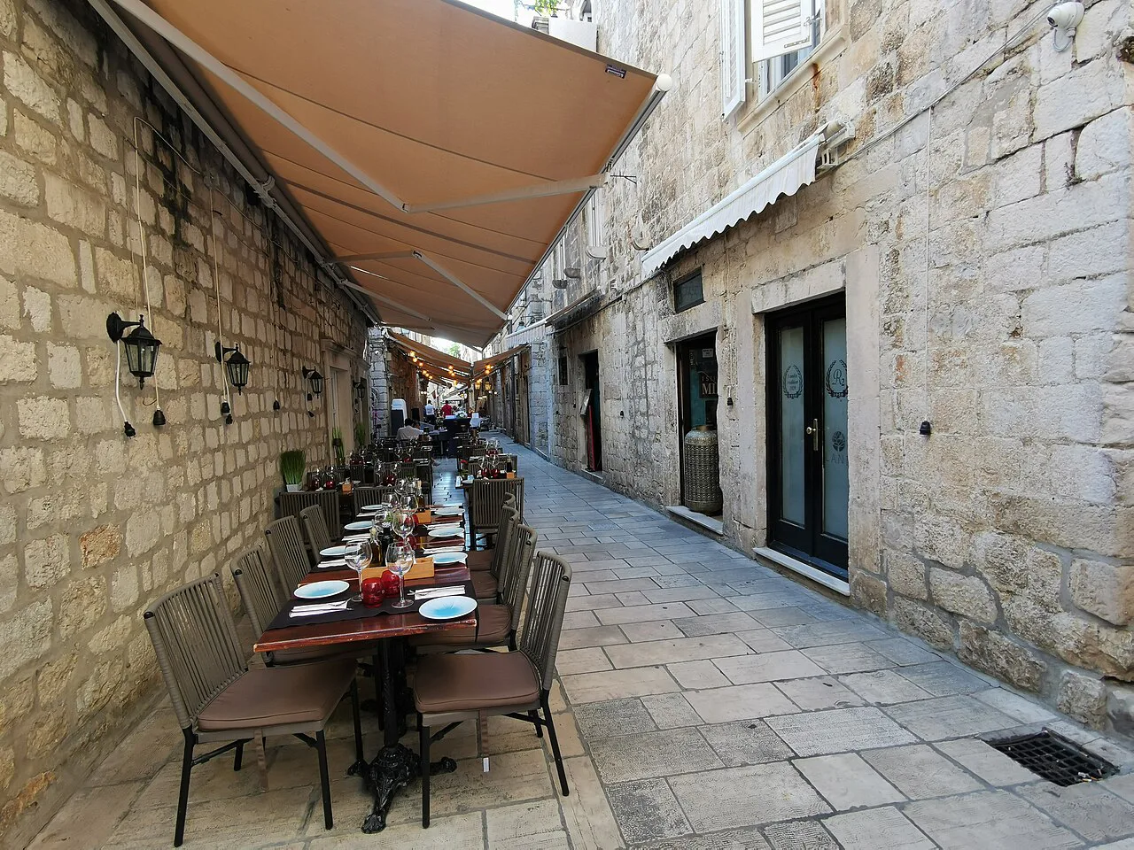 Restaurant tables along Prijeko street in Dubrovnik's old town.