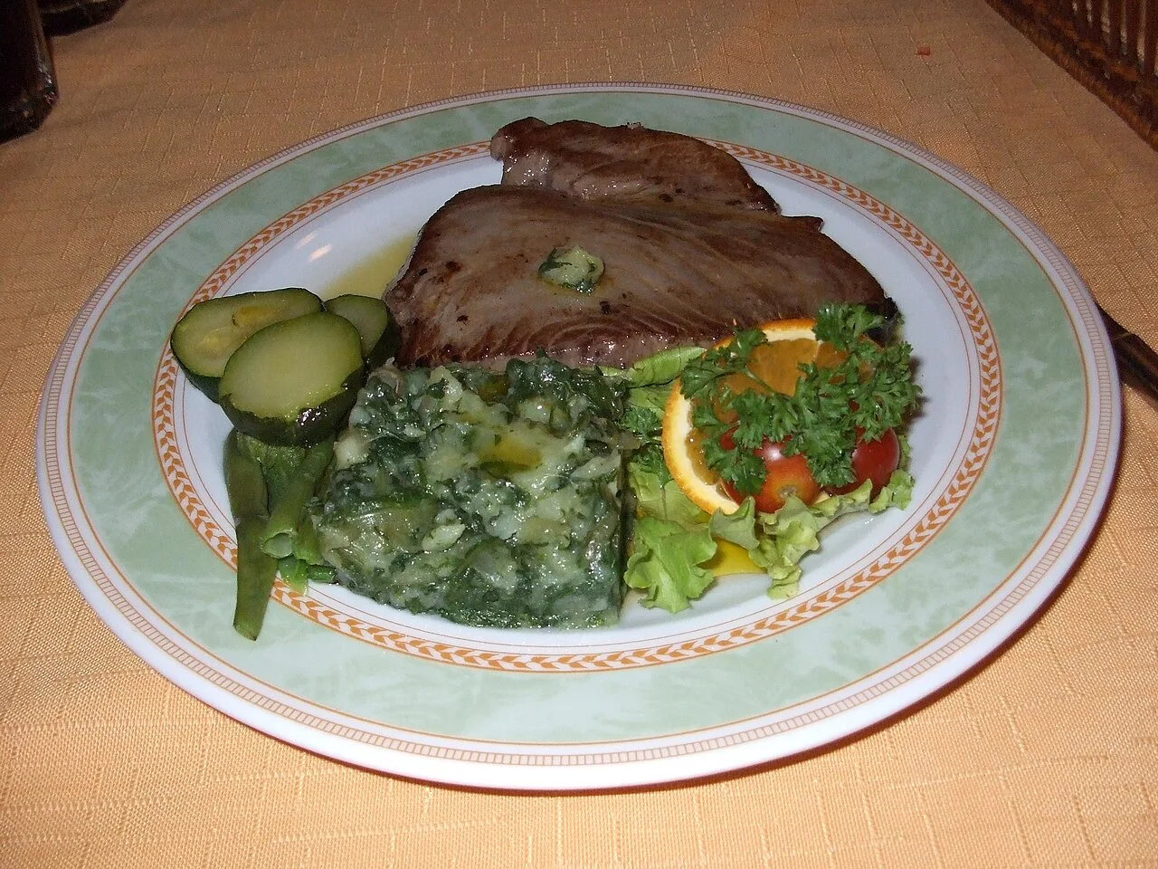 Grilled tuna with mashed potato and spinach.