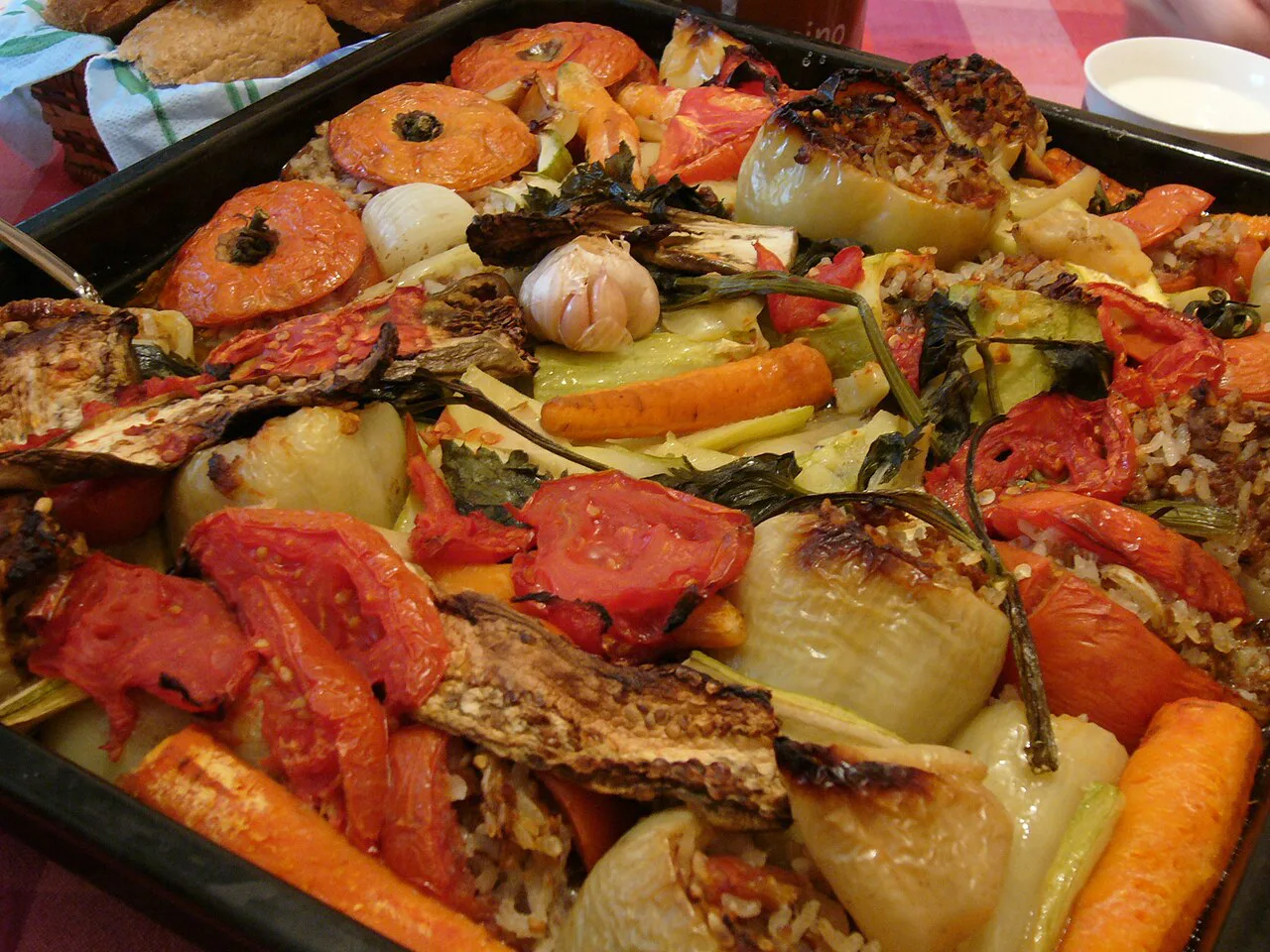 Punjene paprike baked Herzegovinian style with tomatoes and vegetables.