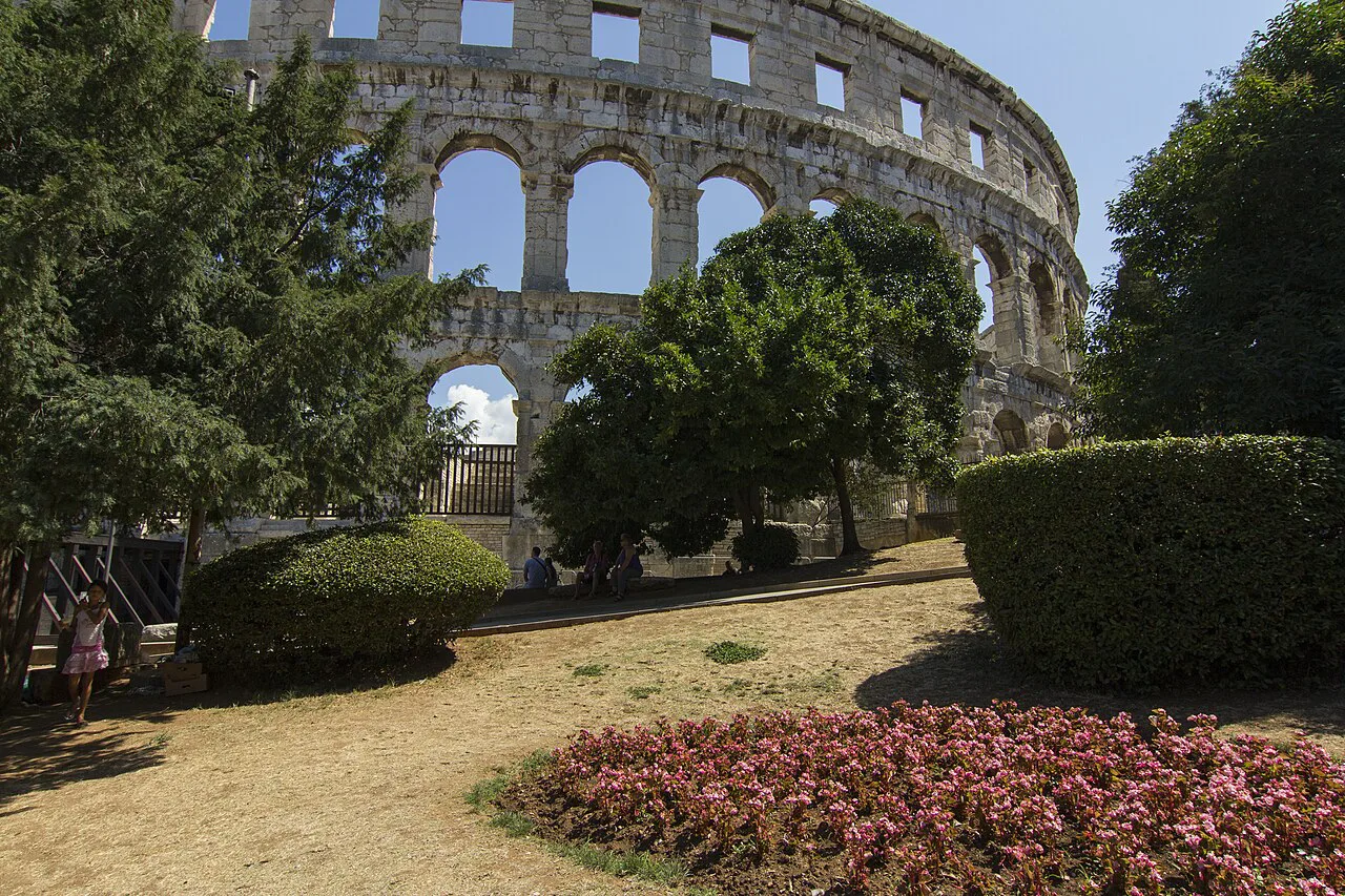 Pula Arena seen from the gardens beside it.
