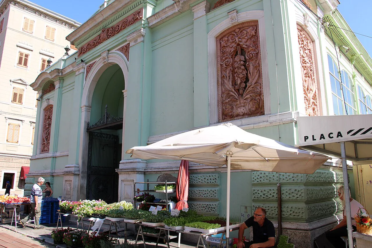 Stalls beside a market pavilion at Rijeka's central market.