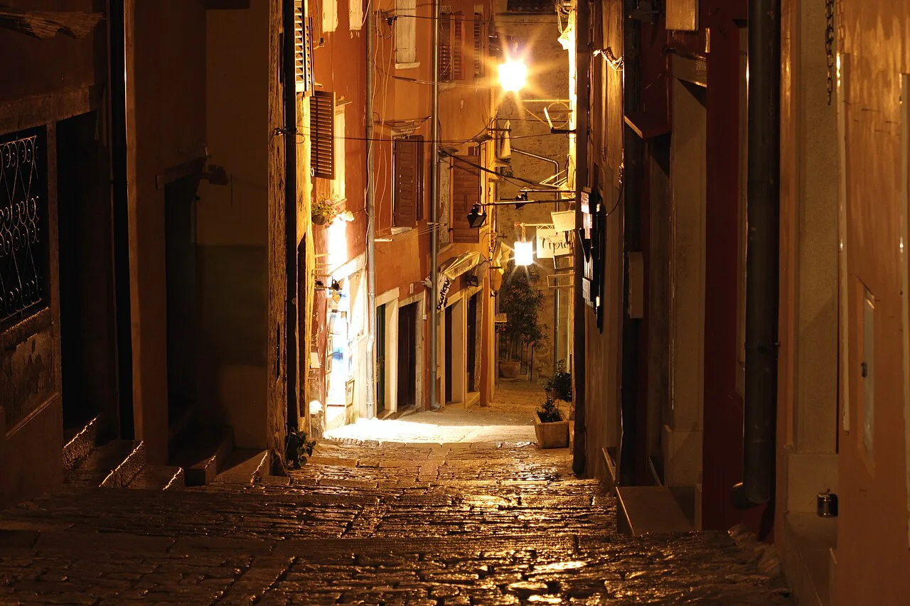 A lamplit street in Rovinj old town.