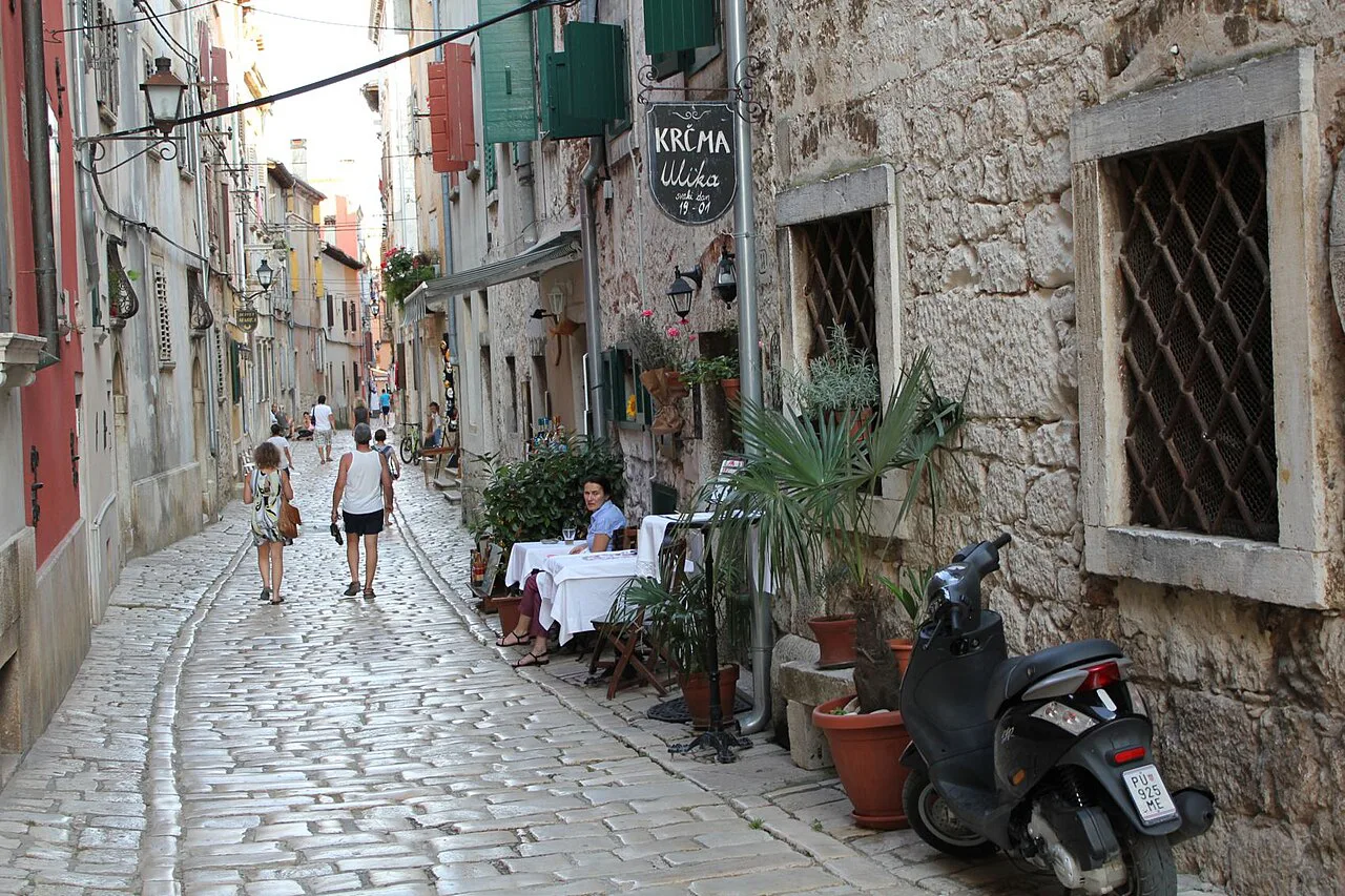 Tables outside a tavern in a lane of Rovinj's old town.