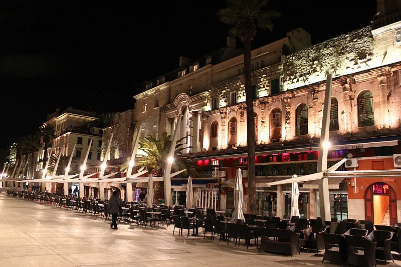 Restaurant and café terraces on the Riva below Diocletian's Palace, Split, at night.