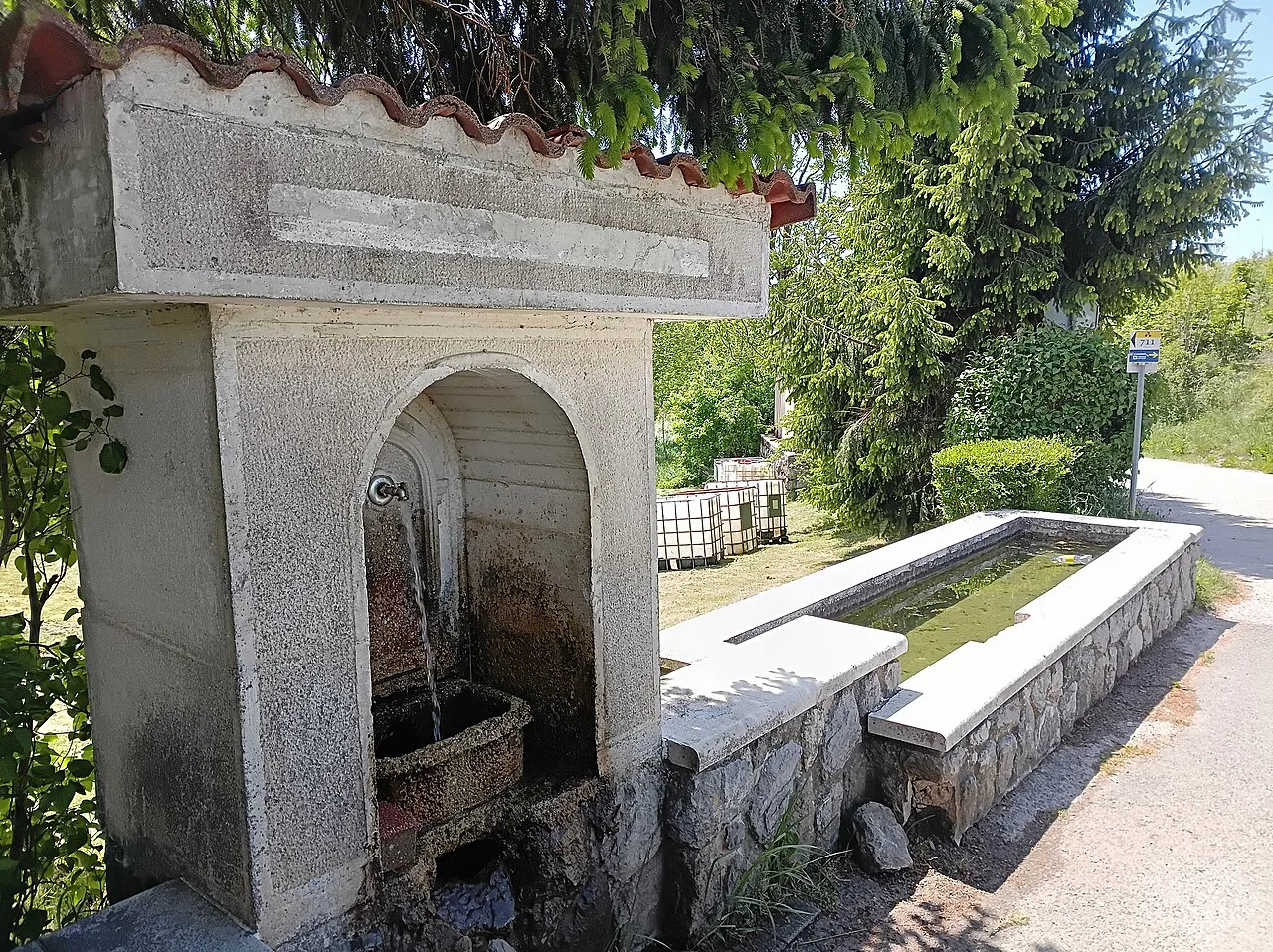 A stone drinking fountain near Belo Selo.