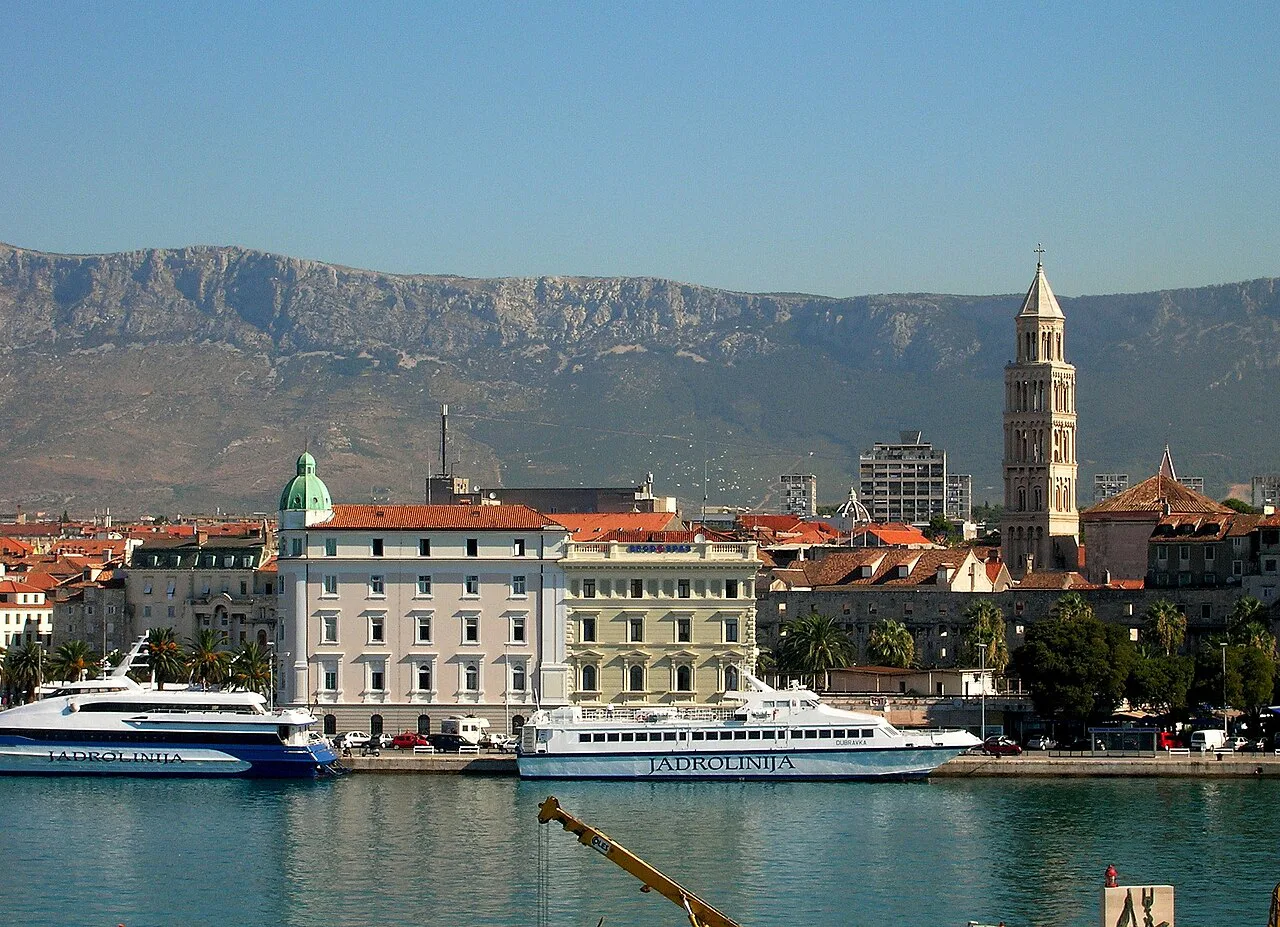 Split's waterfront and cathedral bell tower seen from the sea.