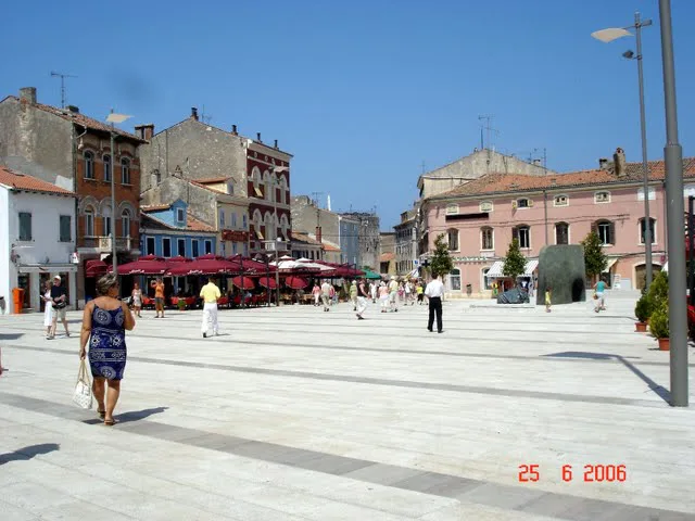 Café terraces on a square in Poreč.