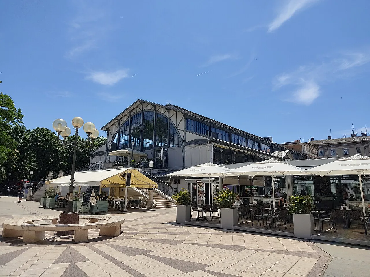 Café terraces beside the market hall, Pula.