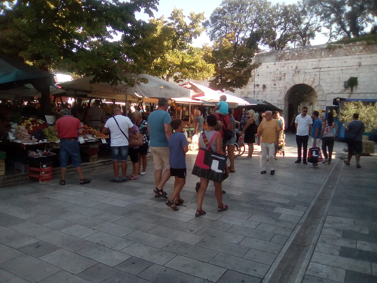 Shoppers at the market by the old-town walls, Zadar.